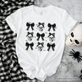thumbnail image 1 of Coquette Skulls and Bows T-Shirt, Gothic Halloween Tee for Stylish Women, 1 of 6