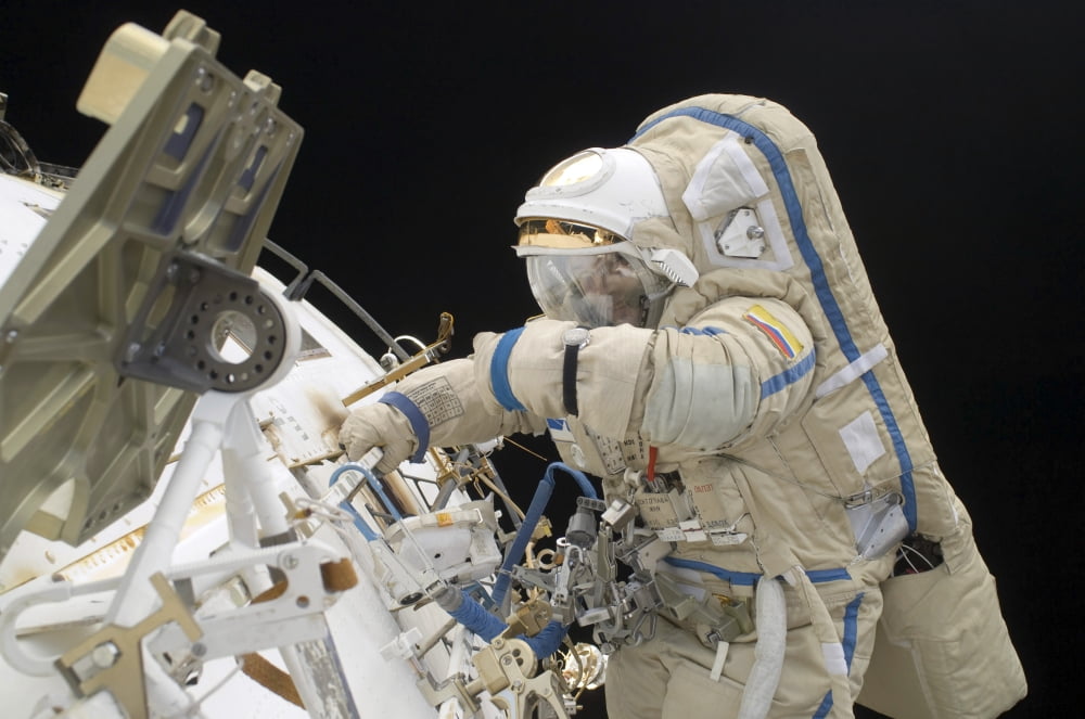 Cosmonaut participates in a session of extravehicular activity Canvas Art - Stocktrek Images (34 x 23)