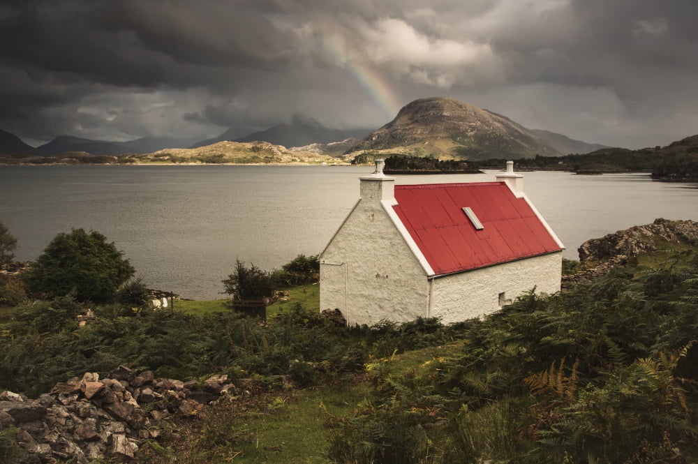 A Cottage With A Red Roof On The Waters Edge With A Rainbow In The Distance Applecross Peninsula Highlands Scotland Canvas Art - John Short Design Pics (38 x 24)