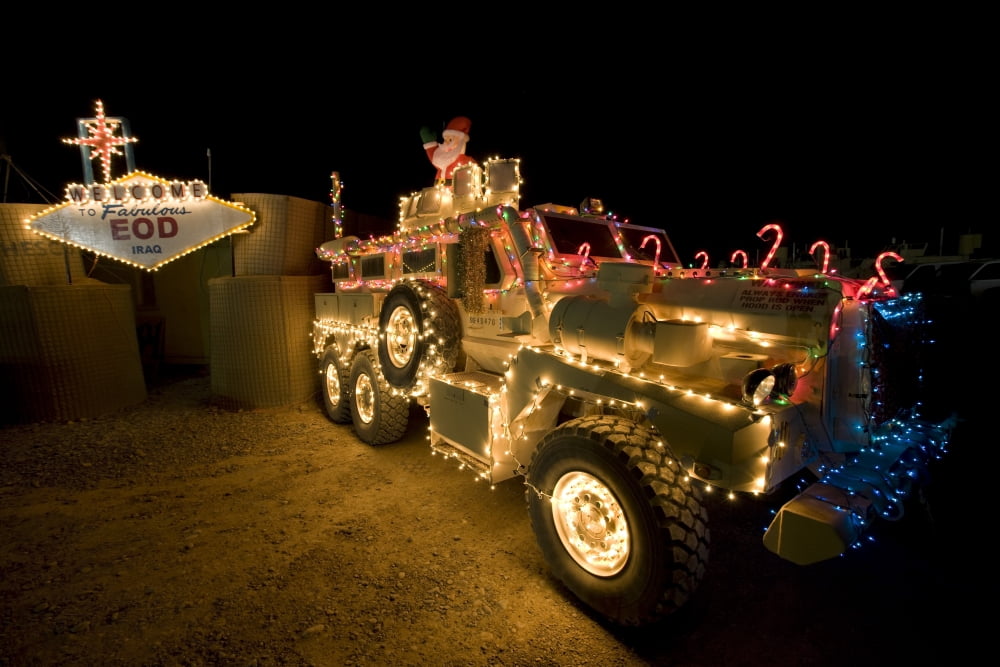 Cougar Mine Resistant Ambush Protected Vehicle adorned in holiday lights Canvas Art - Terry MooreStocktrek Images (18 x 12)