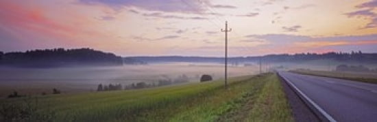 Country road and telephone lines splitting farmlands at dawn Finland Canvas Art - Panoramic Images (36 x 12)