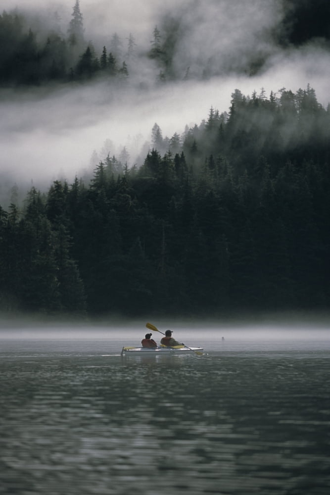 Couple Sea Kayaking In Red Bluff Bay WMist Rolling Off Baranof Isl Chatham Strait Southeast Alaska Canvas Art - Mark Kelley Design Pics (11 x 17)