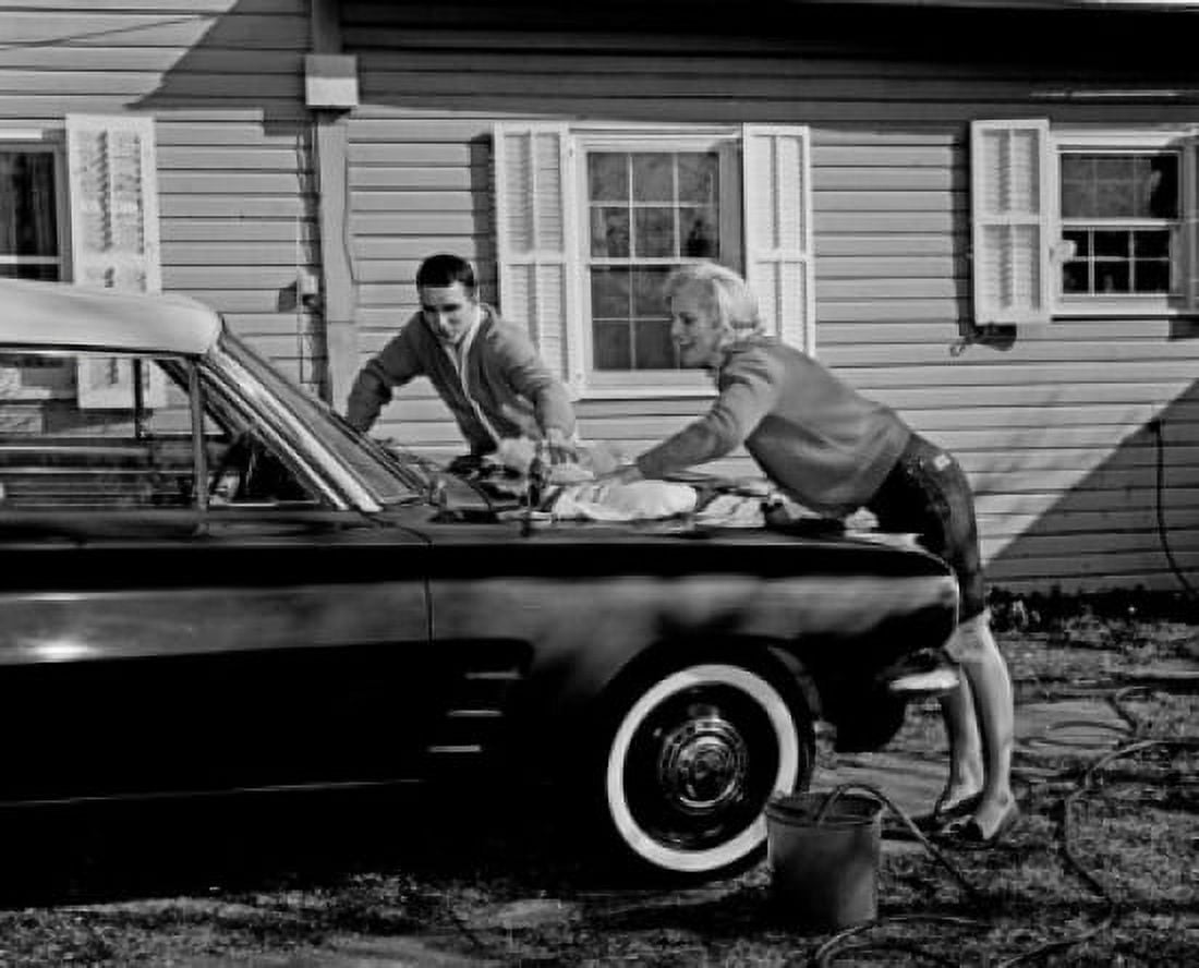 Couple cleaning car outside Canvas Art - (18 x 24)