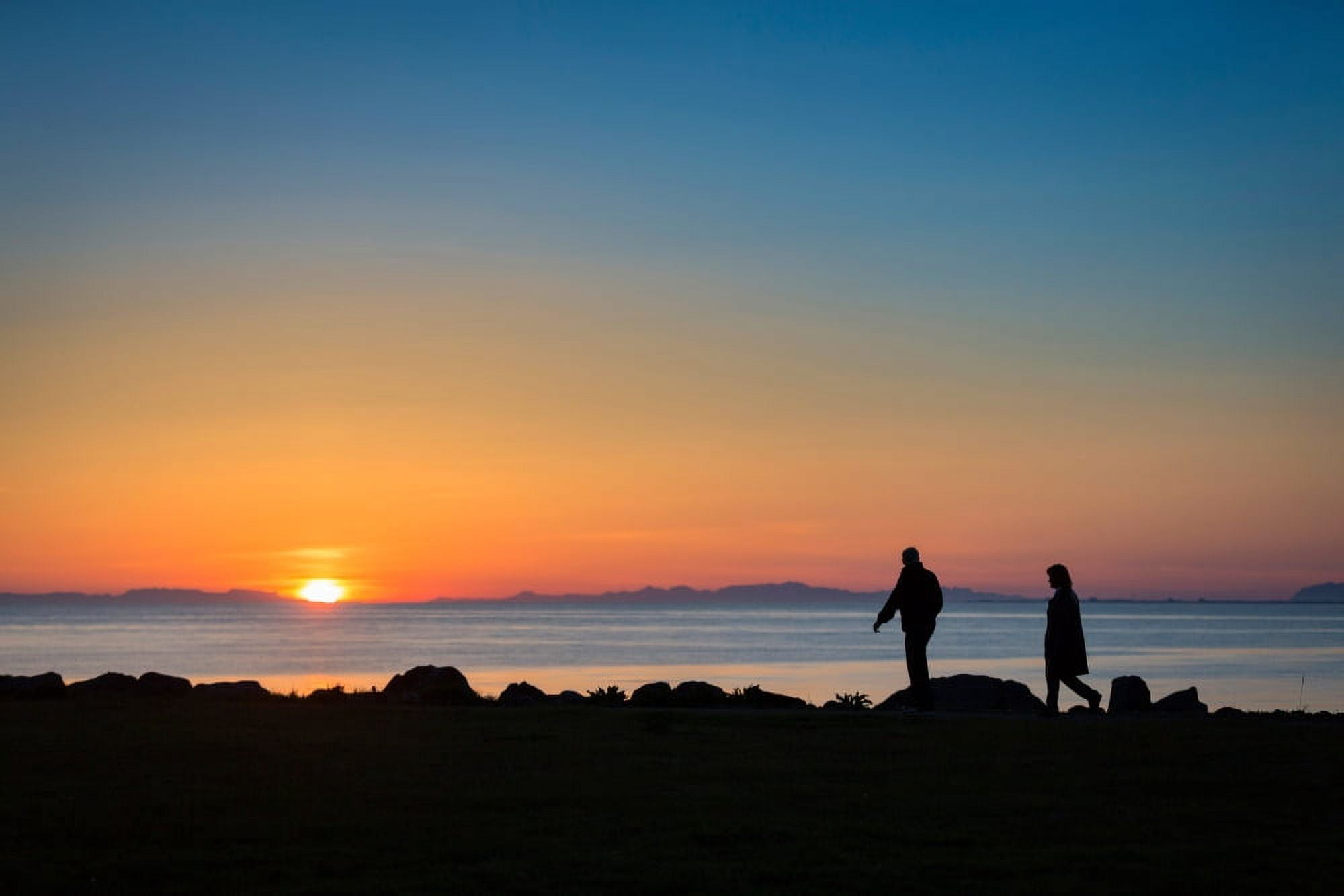 Couple enjoying a walk under the Midnight Sun Seltjarnarnes Reykjavik Iceland Canvas Art - Panoramic Images (27 x 9)