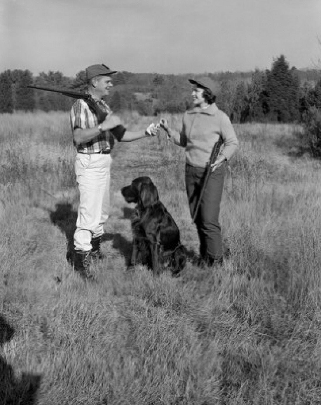 Couple hunting with gun dog Canvas Art - (24 x 36)