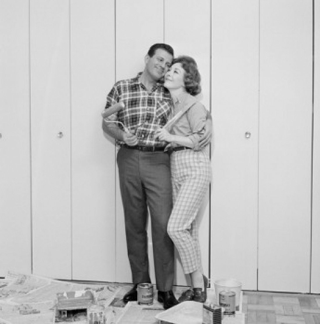 Couple in front of freshly painted garage door Canvas Art - (18 x 24)
