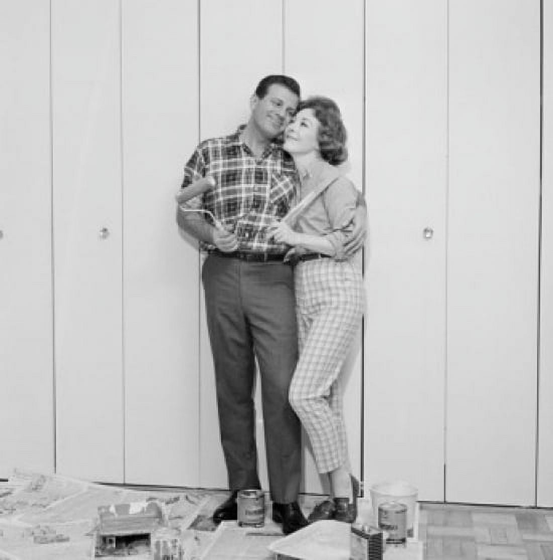 Couple in front of freshly painted garage door Canvas Art - (24 x 36)