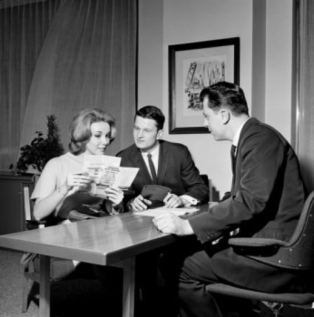 Couple reading advertisement prospect Canvas Art - (24 x 36)