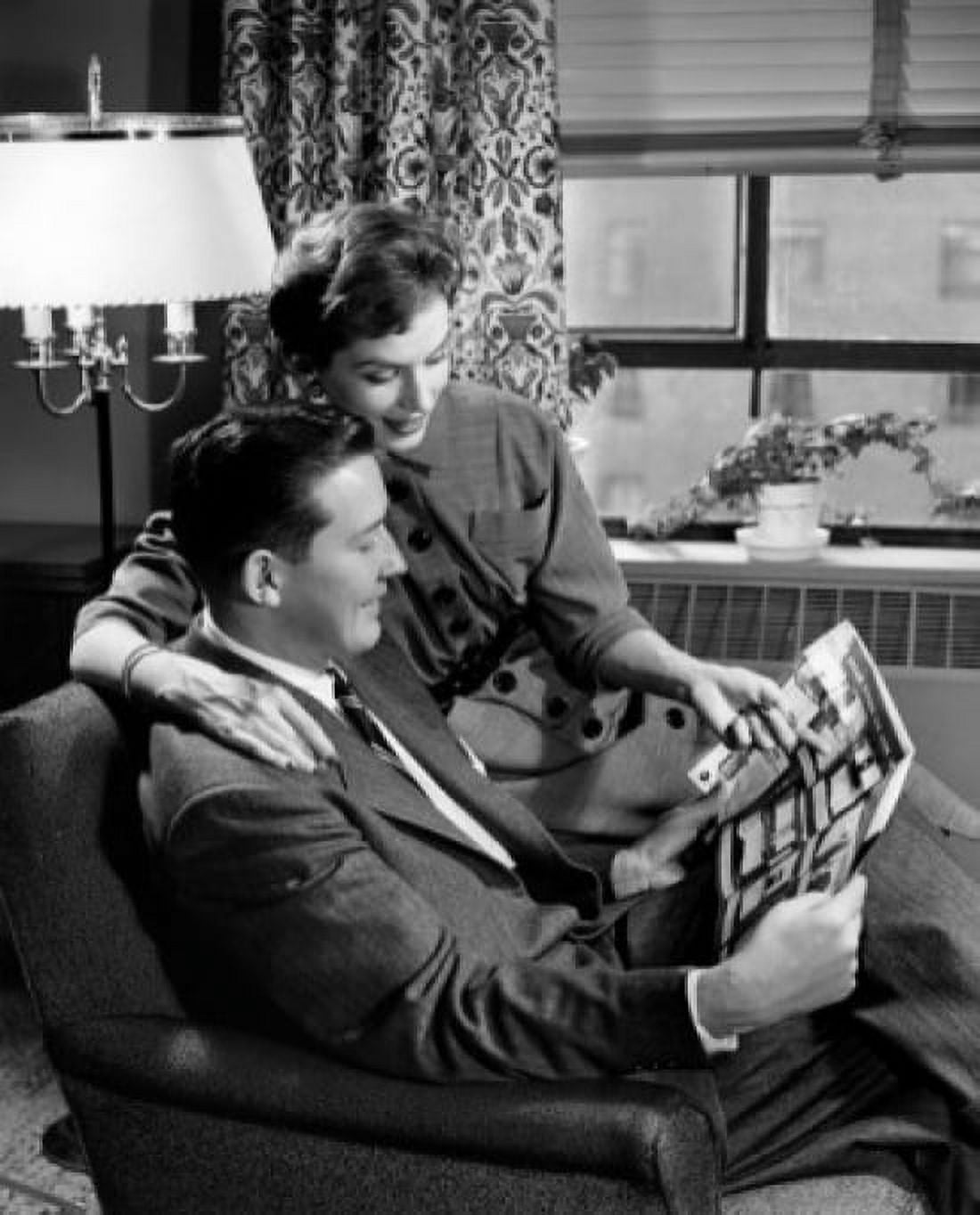 Couple reading magazine Canvas Art - (24 x 36)