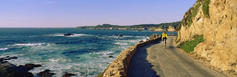 Couple riding bicycles along California Coast Monterey California USA Canvas Art - Panoramic Images (27 x 9)