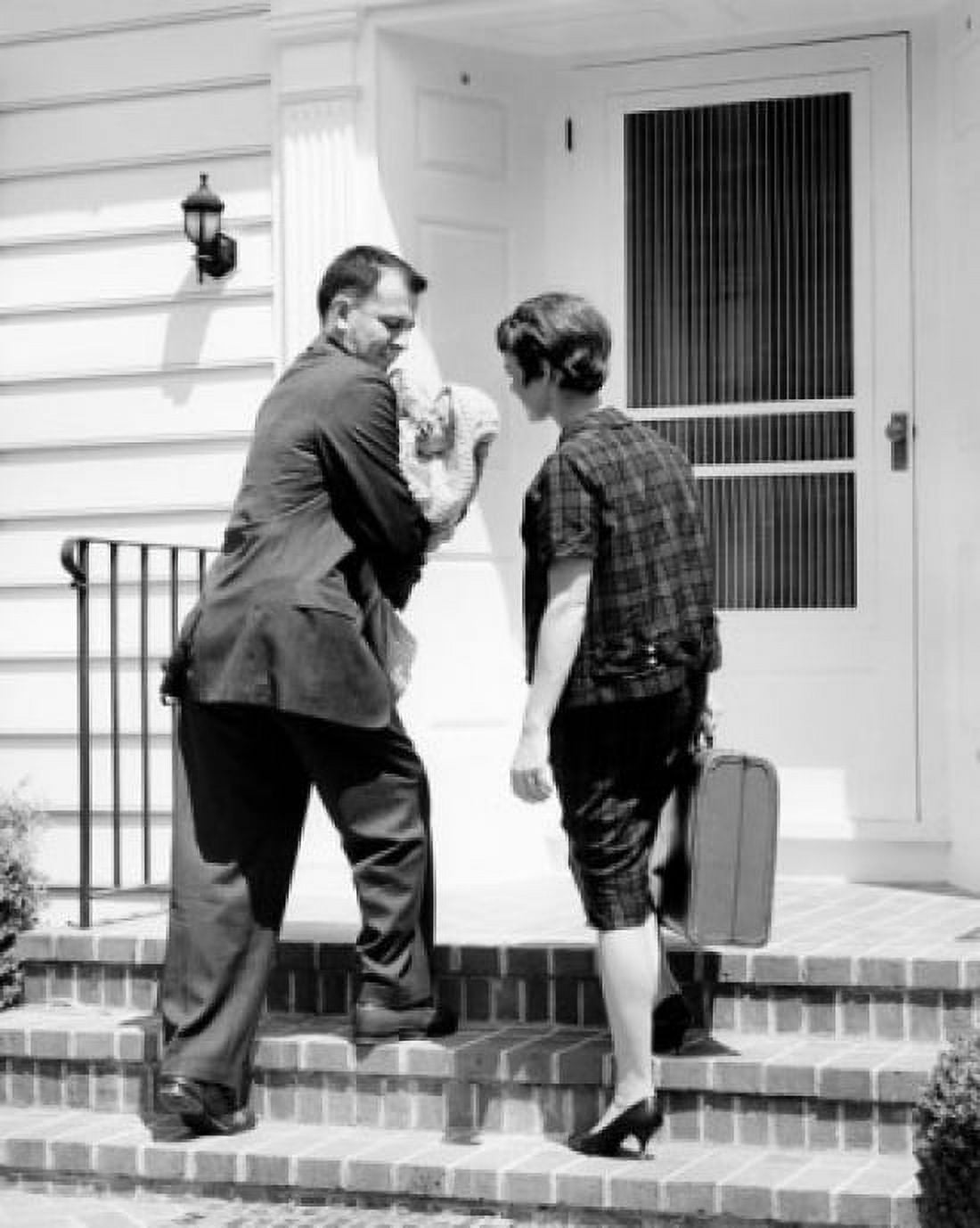 Couple with baby outside home Canvas Art -  (18 x 24)
