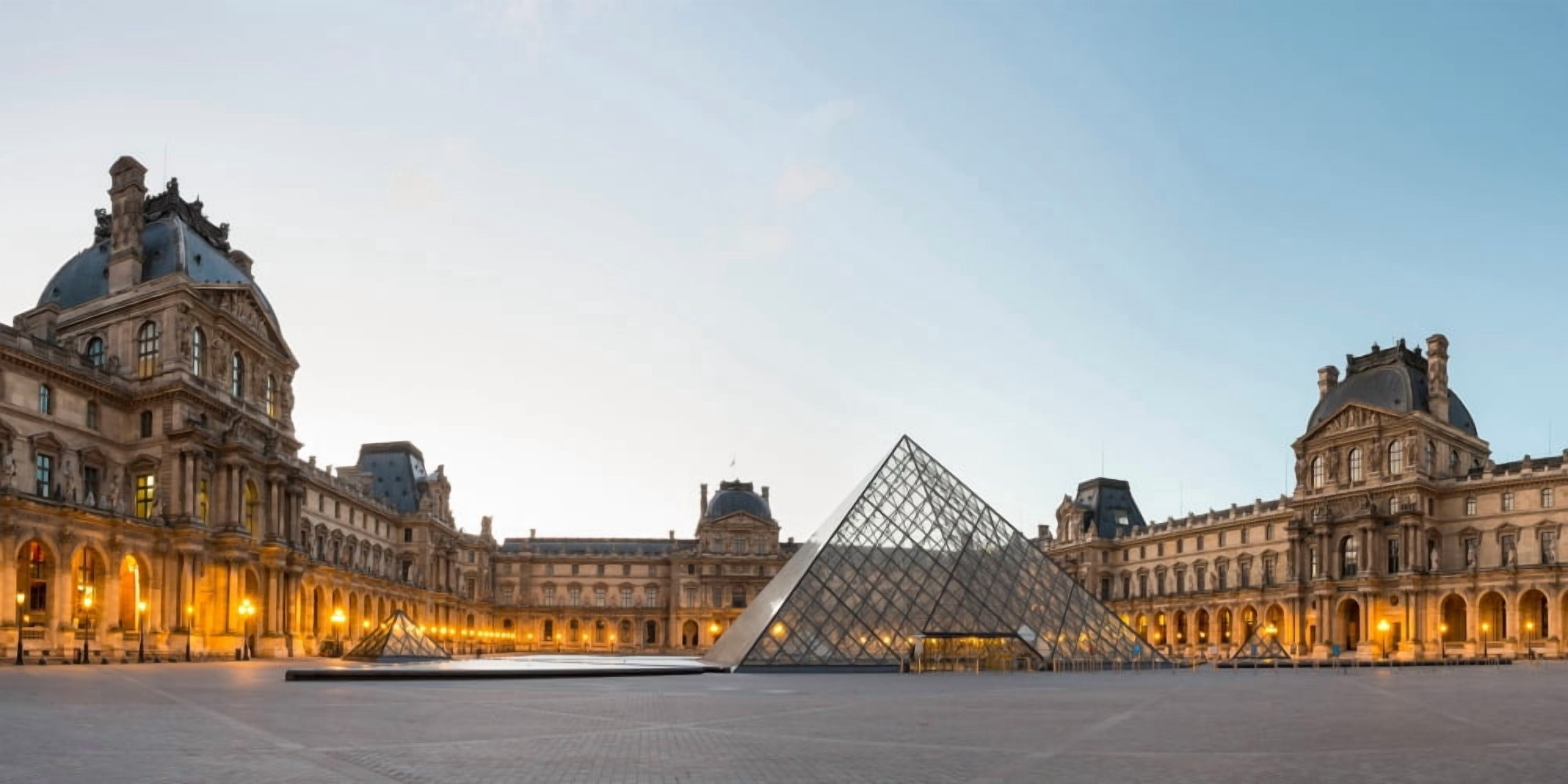 Courtyard and glass pyramid of the Louvre Museum at sunrise Paris Ile-de-France France Canvas Art - Panoramic Images (9 x 27)