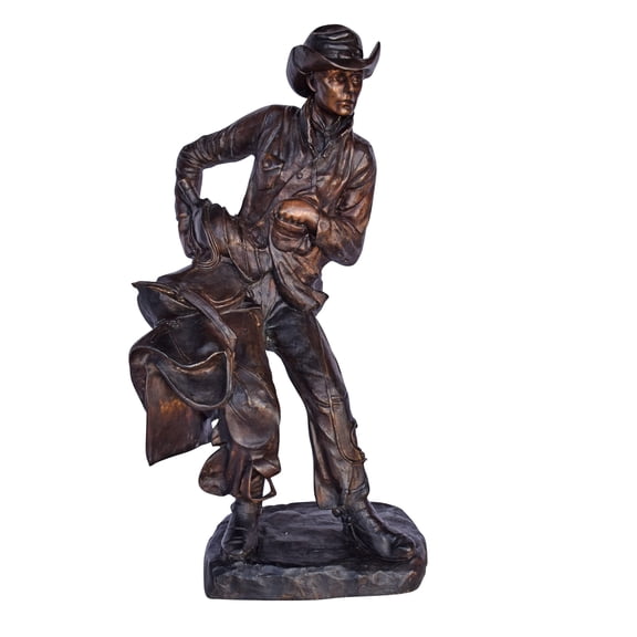 Cowboy Holding His Saddle Bronze Statue - Size: 20"L x 14"W x 35"H.