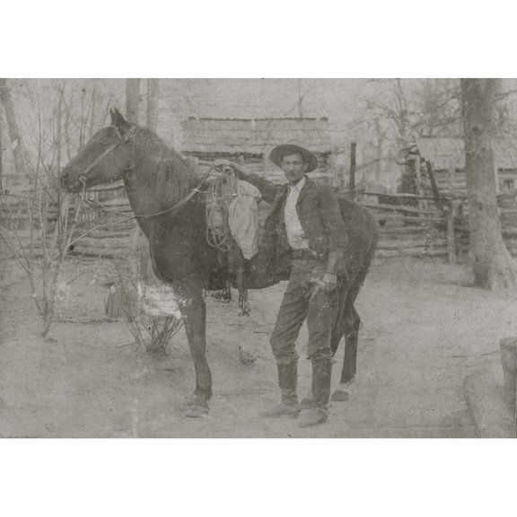 Cowboy And Horse, Circa 1880S. "Mr. W.B. Krebs," Standing Next To His Horse. Behind Them Can Be Seen Rough Cabins Surrounded By Post And Rail Fences. Poster Print (24 x 36)