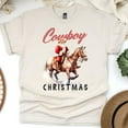 thumbnail image 1 of Cowboy Santa Claus Graphic T-Shirt | Western Holiday Tee for Men Women, Natural, Size S, 1 of 6