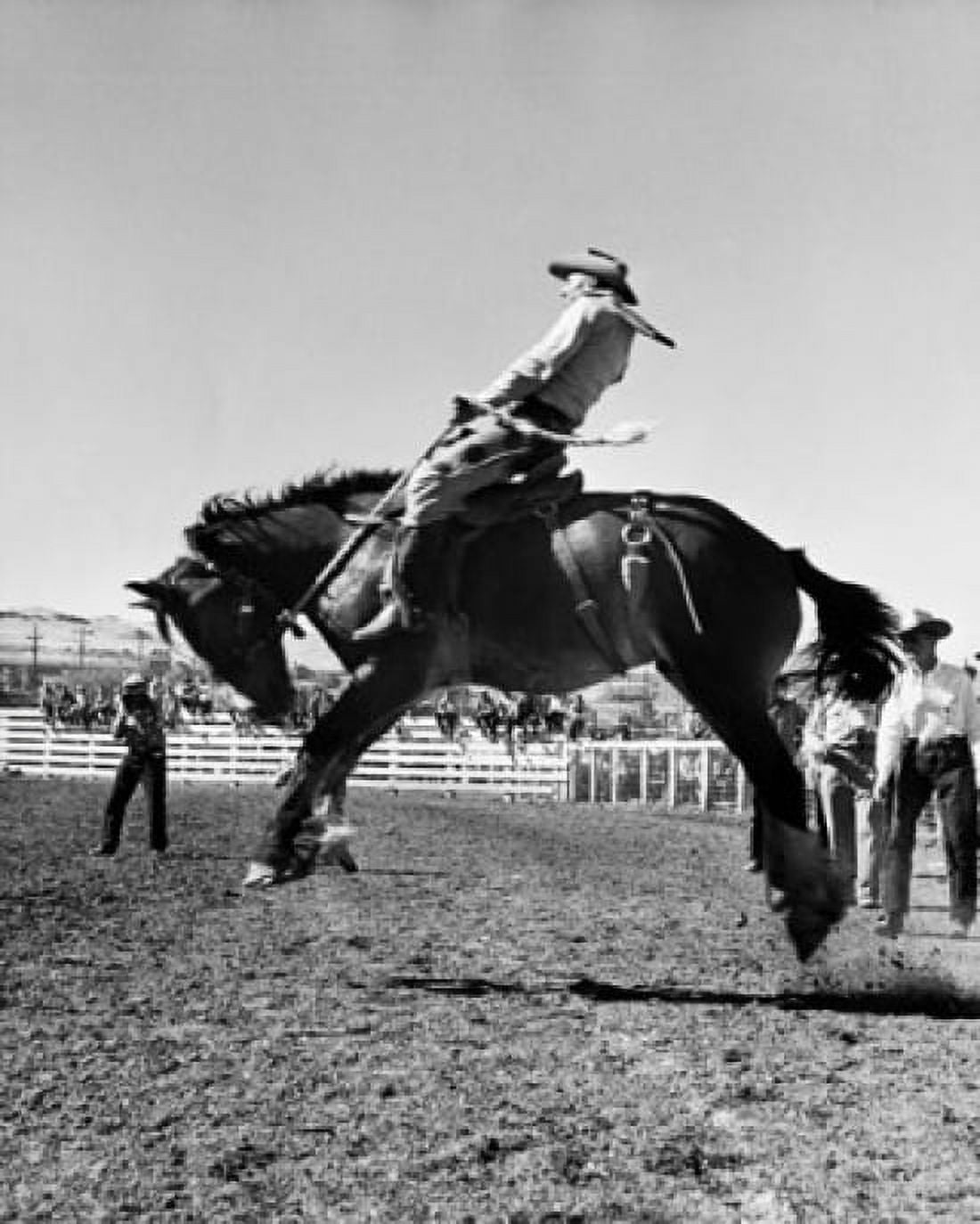 Cowboy riding a bucking horse in a rodeo Canvas Art - (24 x 36)
