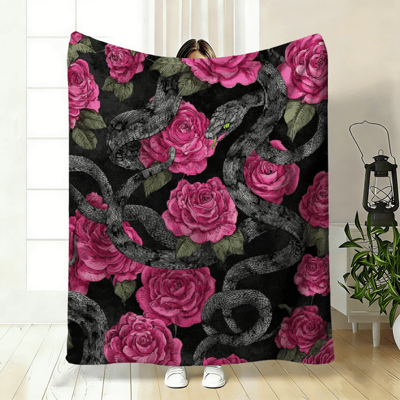 A Cozy Flannel Blanket Featuring a Snake And Rose Theme, Made of Soft, High-Definition Digital Print. It Has a Black Background with Pink Roses And Snake Patterns.