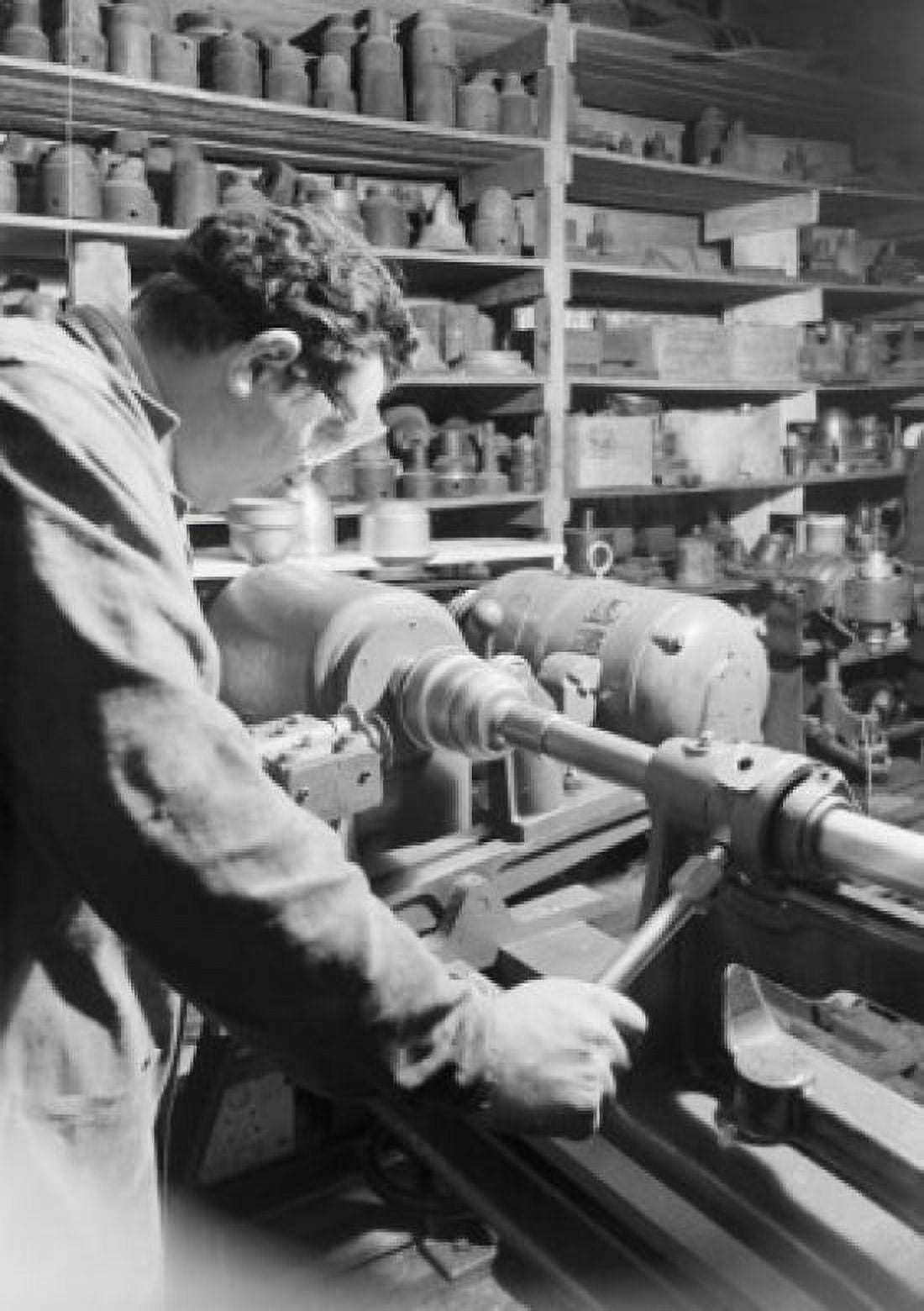 Craftsman using machine in workshop Canvas Art - (18 x 24)