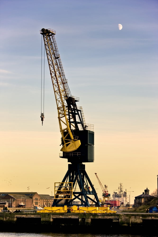 Crane At A Harbour Canvas Art - John Short Design Pics (12 x 18)