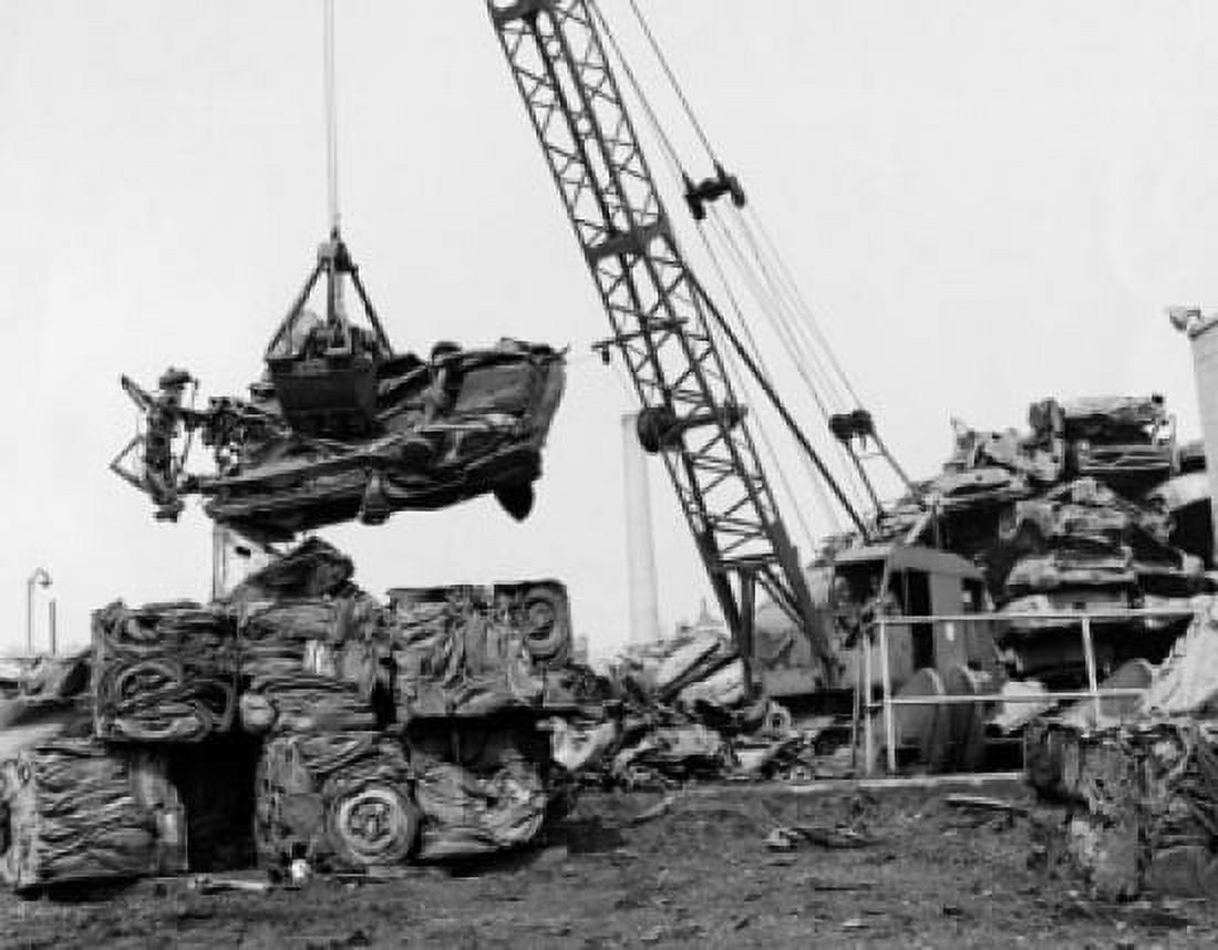 Crane carrying a damaged car at a junkyard Canvas Art - (24 x 36)