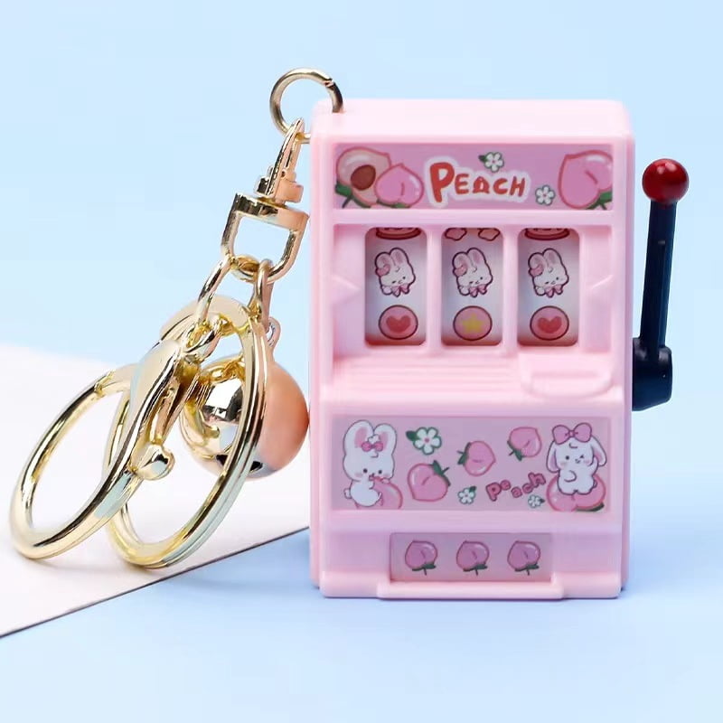 Creative fruit machine key chain can play small pendant rocker movable ...