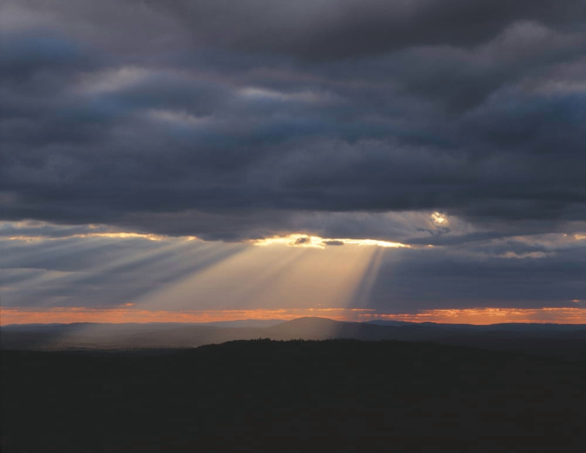 Crepuscular rays breaking out from behind a cloud Canvas Art - Panoramic Images (27 x 9)
