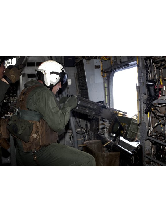 Crew chief fires an M2 50-caliber heavy machine gun from a CH-53E Super Stallion Canvas Art - Stocktrek Images (35 x 23)