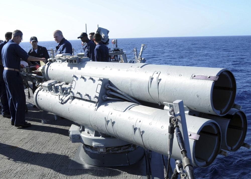 Crew members aboard the guided-missile destroyer USS Porter loading a Mark 46 recoverable exercise torpedo Canvas Art - Stocktrek Images (34 x 24)