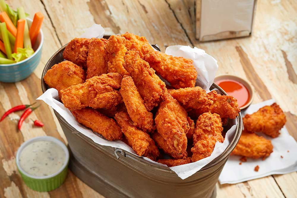 Crispy Fliers Fully Cooked Dusted Spicy Chicken Wings, 5 Pound - 3 per case.