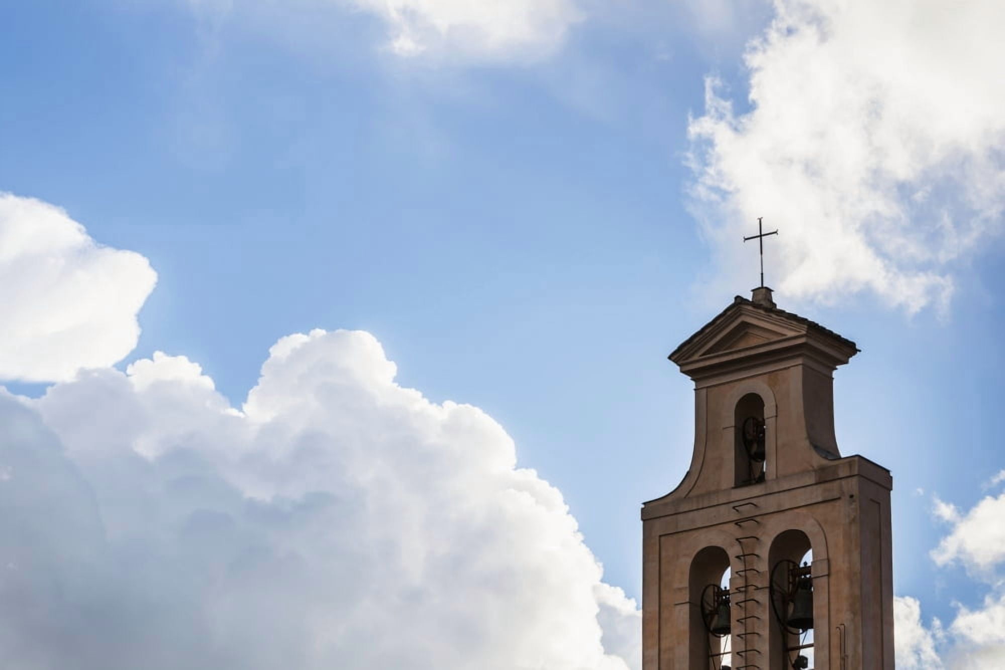 Cross and bell tower of a church against a blue sky with cloud Rome Italy Canvas Art - Reynold Mainse Design Pics (38 x 24)