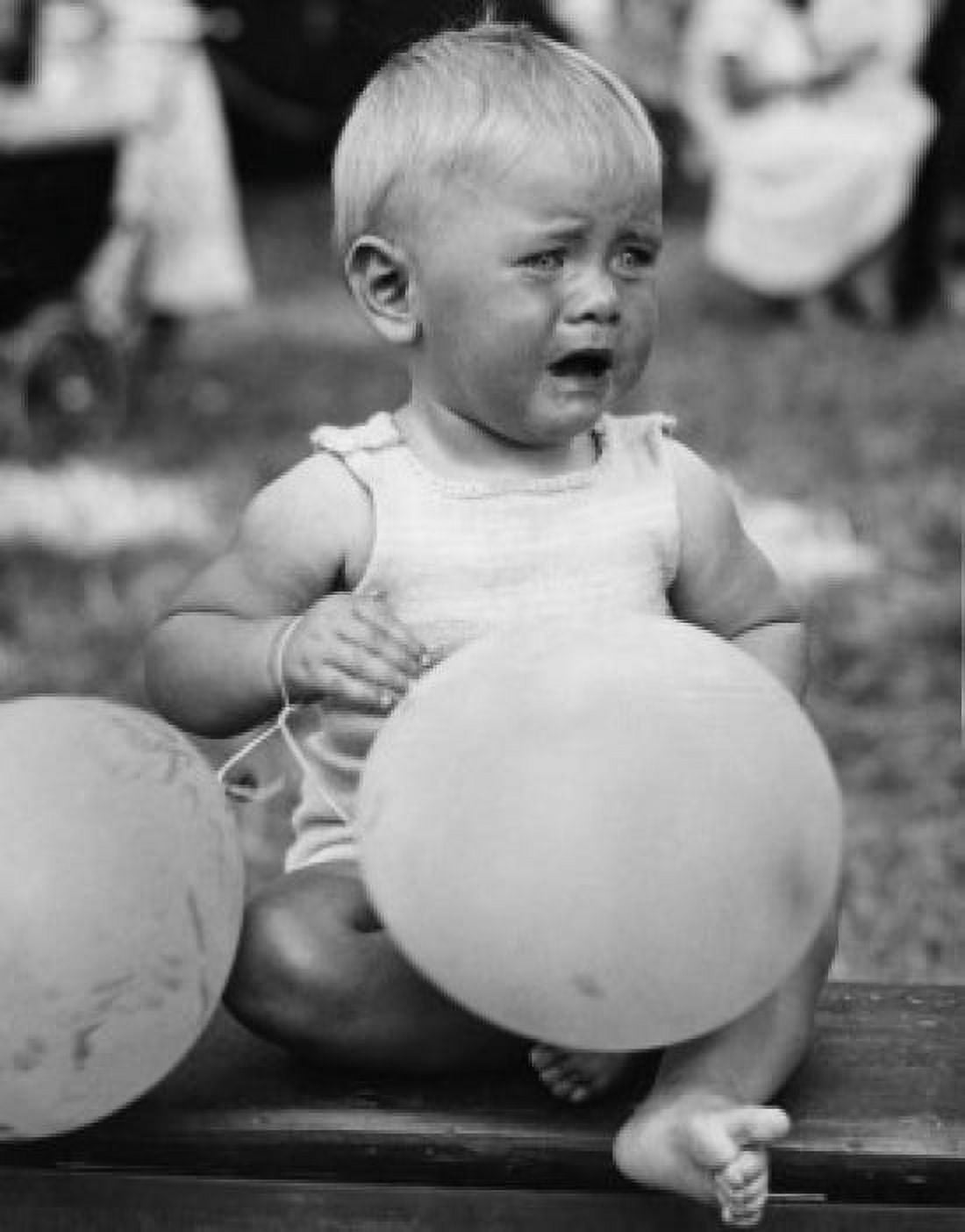 Crying baby girl with balloons Canvas Art - (24 x 36)