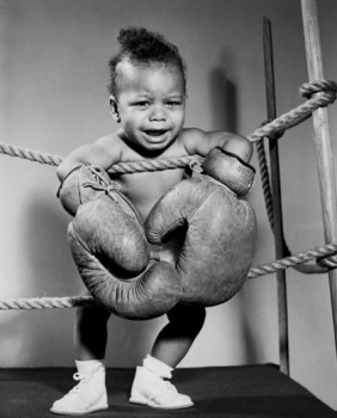 Crying baby wearing boxing gloves Canvas Art - (24 x 36)