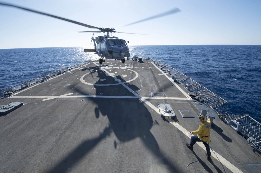 Cryptologic Technician directs an SH-60R Sea Hawk helicopter Canvas Art - Stocktrek Images (34 x 23)