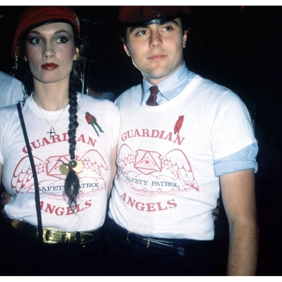 Curtis Sliwa and wife Lisa founders of New Yorks Guardian Angels wearing signature red berets and t-shirts at event 1970s. Photo: Oscar