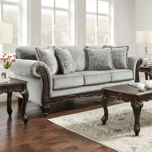 Cushion back and rolled arms, carved face panel | In living room, offers a comfortable sitting experience