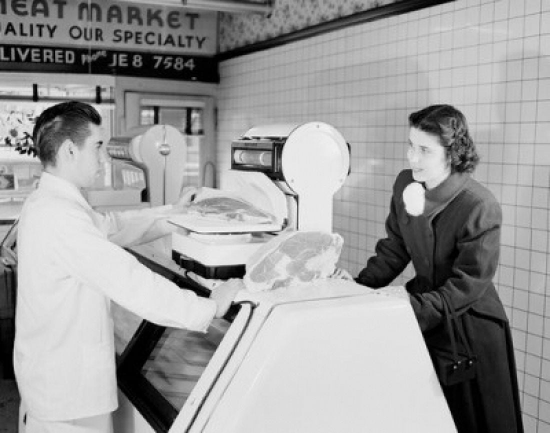 Customer and sales clerk choosing meat in butchers shop Canvas Art - (18 x 24)