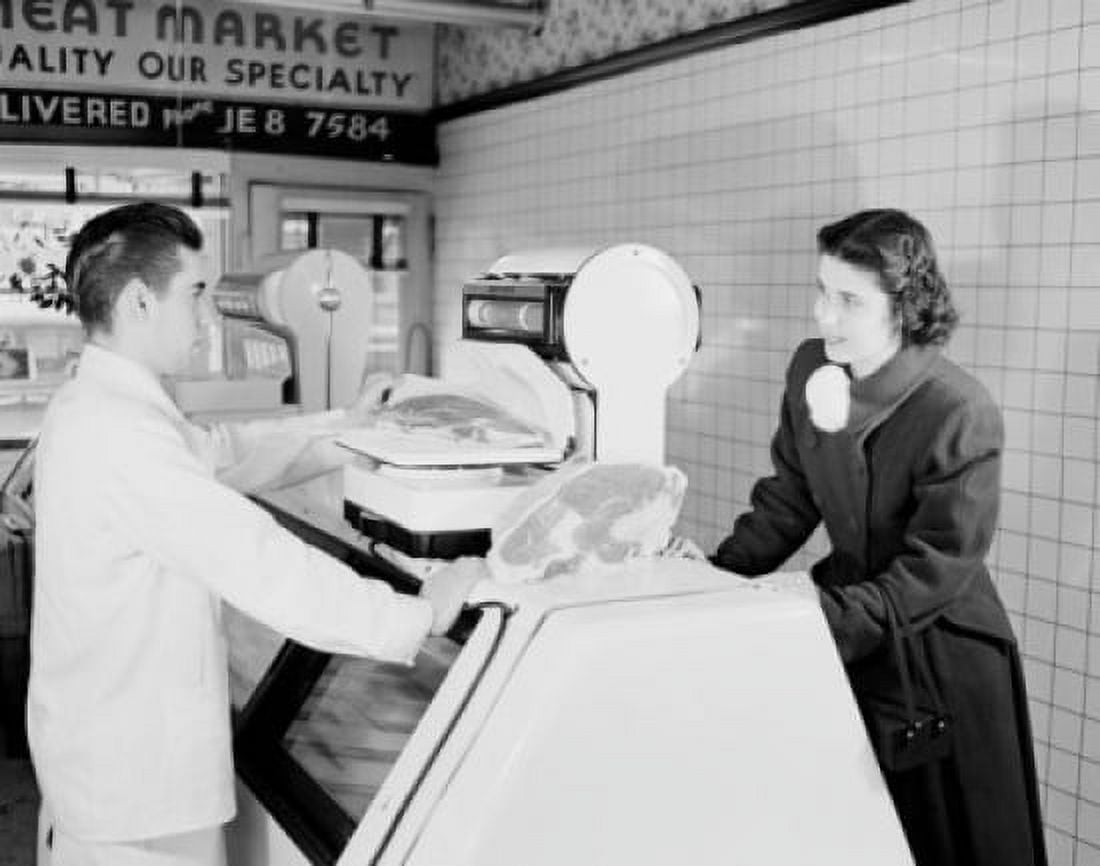 Customer and sales clerk choosing meat in butchers shop Canvas Art - (24 x 36)