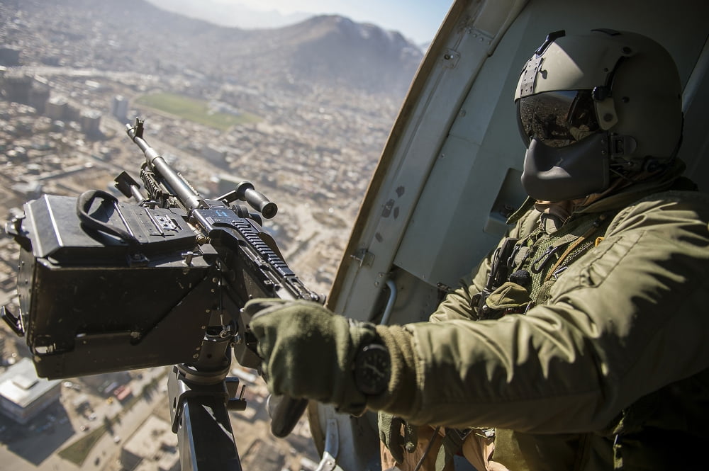 Czech Air Force door gunner scans the ground from a Mi-17 helicopter Canvas Art - Stocktrek Images (35 x 23)