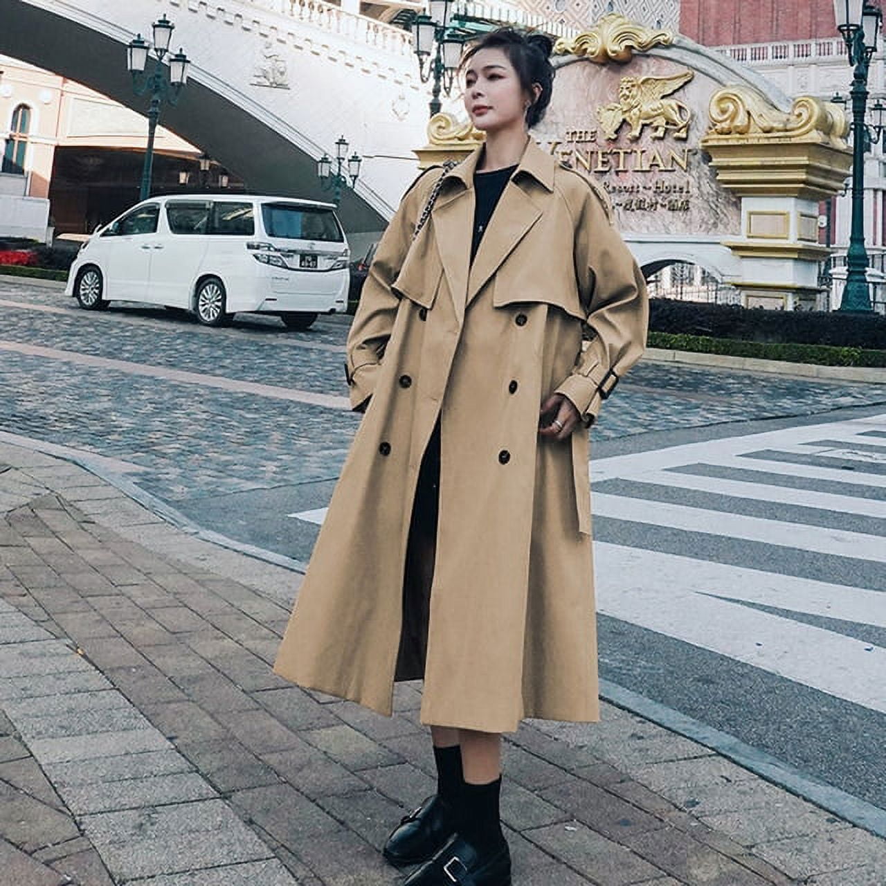 Double-breasted trench coat with belted closure
