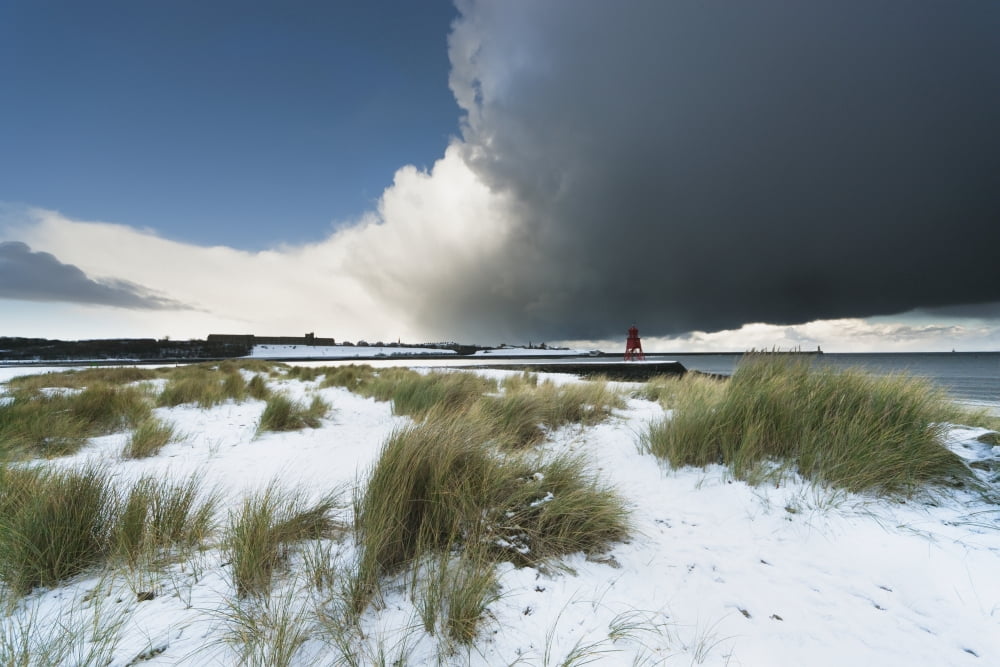Dark Clouds And Blue Sky Over A Red Lighthouse Along The Coast In The Winter South Shields Tyne And Wear England Canvas Art - John Short Design Pics (38 x 24)