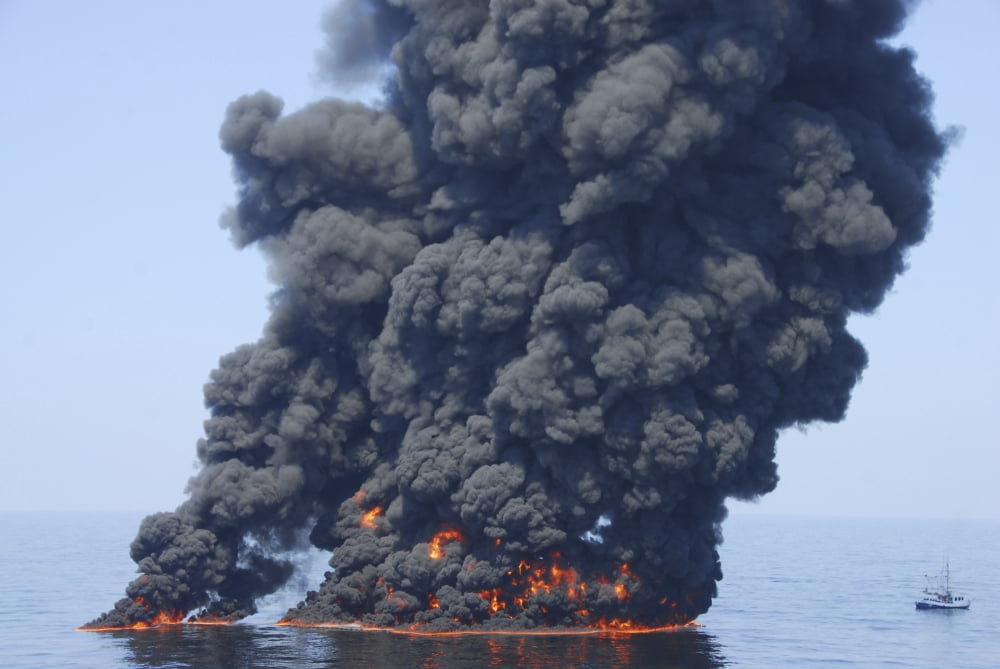 Dark clouds of smoke and fire emerge as oil burns during a controlled fire in the Gulf of Mexico Canvas Art - Stocktrek Images (34 x 23)