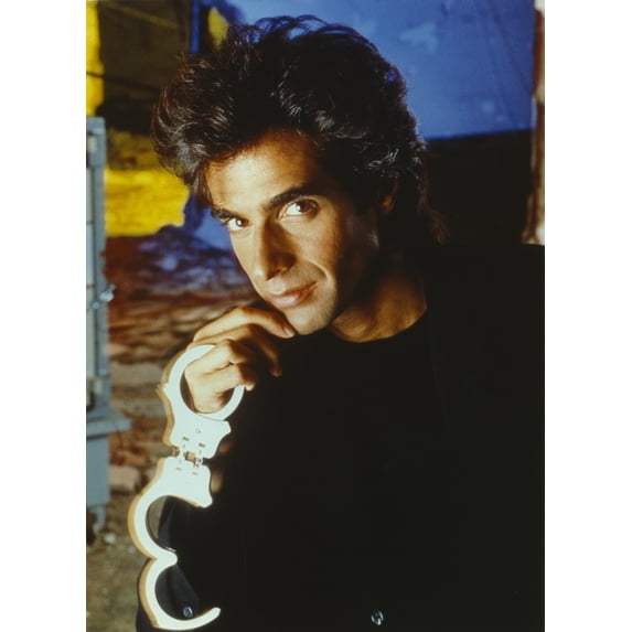 David Copperfield Holding Handcuffs in Black Shirt Photo Print (8 x 10)