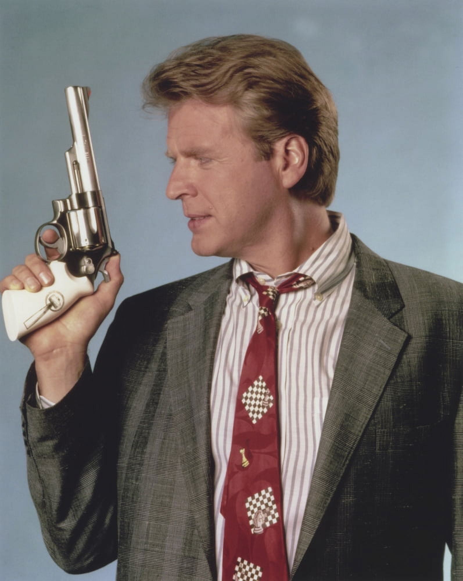 David Rasche Holding a Pistol in Black Suit with Red Tie Photo Print (8