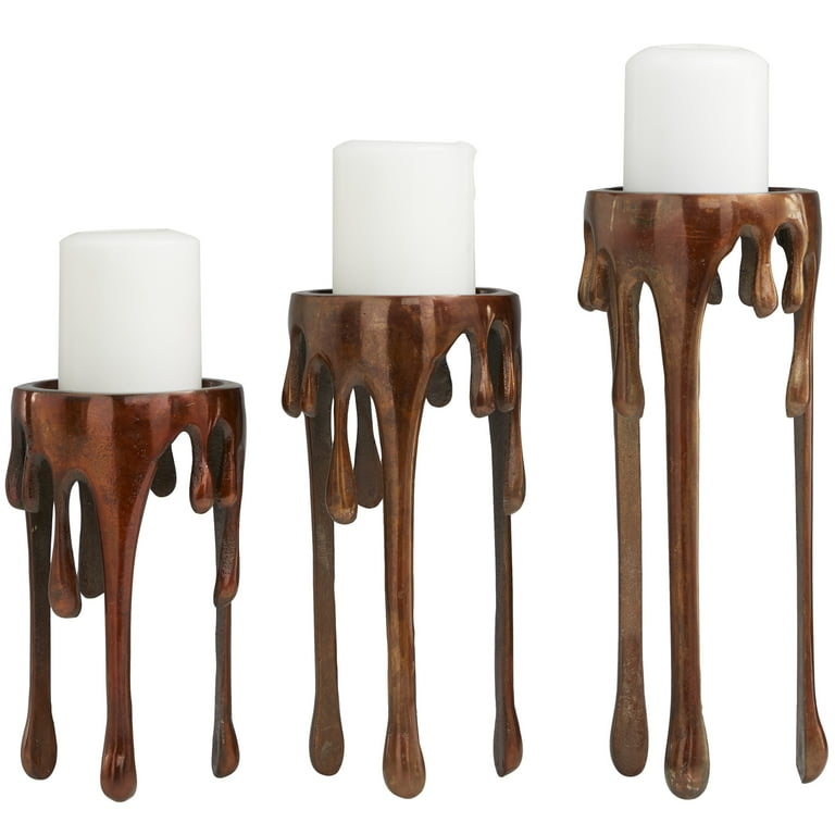 https://i5.walmartimages.com/seo/DecMode-3-Candle-Copper-Aluminum-Pillar-Candle-Holder-with-Dripping-Melting-Designed-Legs-Set-of-3_075cf066-6f15-426b-8377-91e2bb7ec232.673b16e01b494190a7ee36afae90a01a.jpeg?odnHeight=768&odnWidth=768&odnBg=FFFFFF