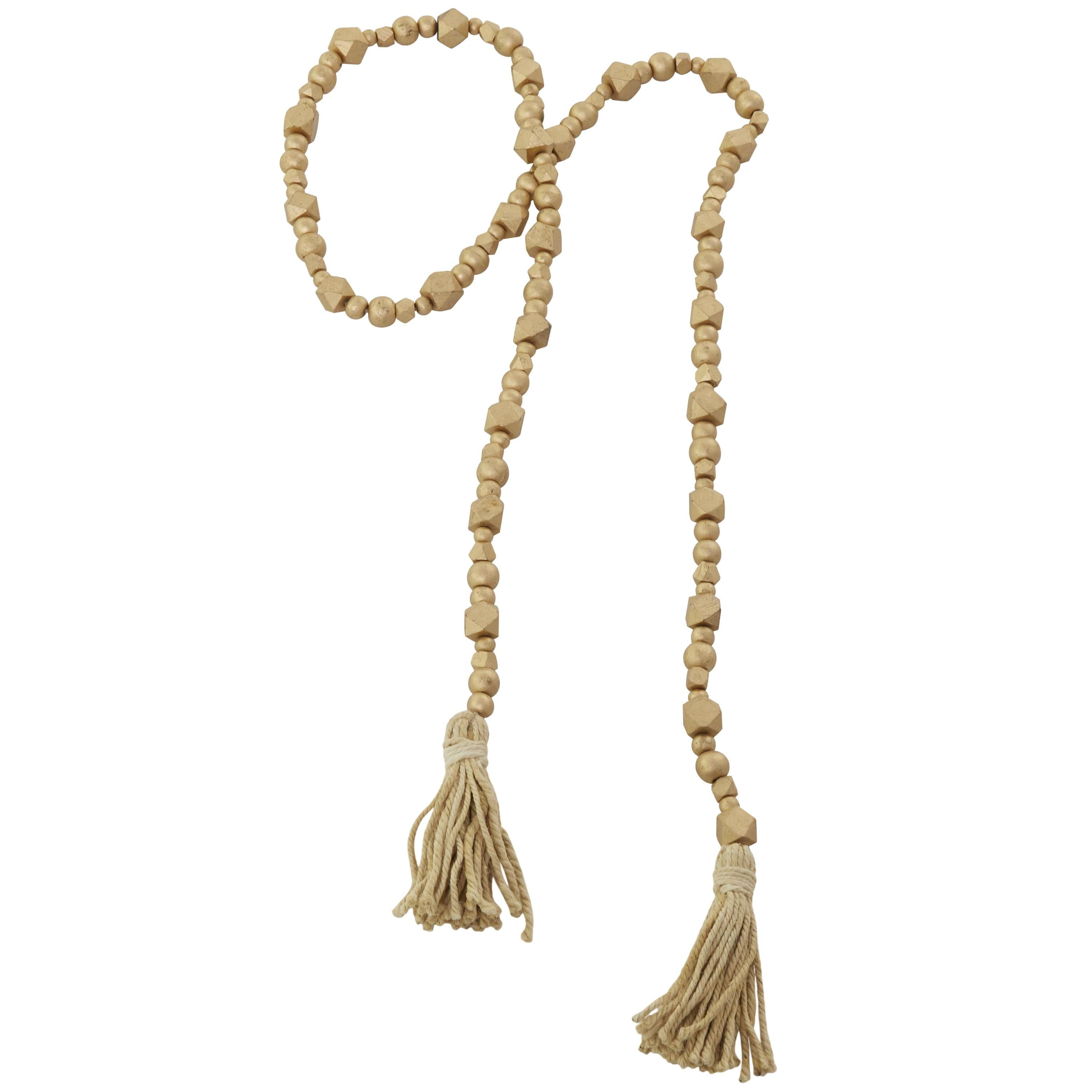 DecMode Handmade Hexagon Metallic Carved Geometric Long Gold Mango Wood Garland with Tassel
