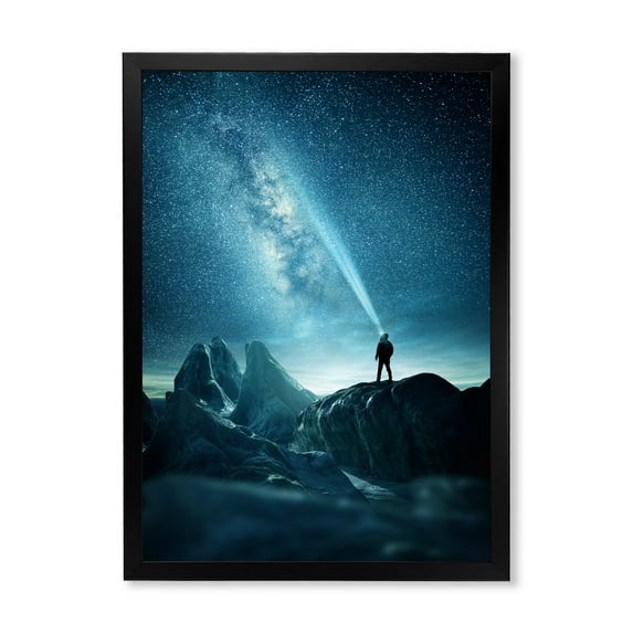 Designart 'A Light Shining by A Man Shining Into The Night Sky' Modern Framed Art Print