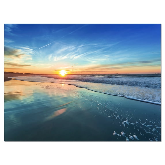 Designart 'Blue Seashore with Distant Sunset ' Seascape Canvas Art Print