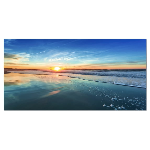 Designart 'Blue Seashore with Distant Sunset ' Seascape Canvas Art Print