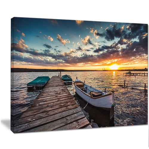 Designart 'Boats and Jetty under Dramatic Sky ' Modern Canvas Art Print