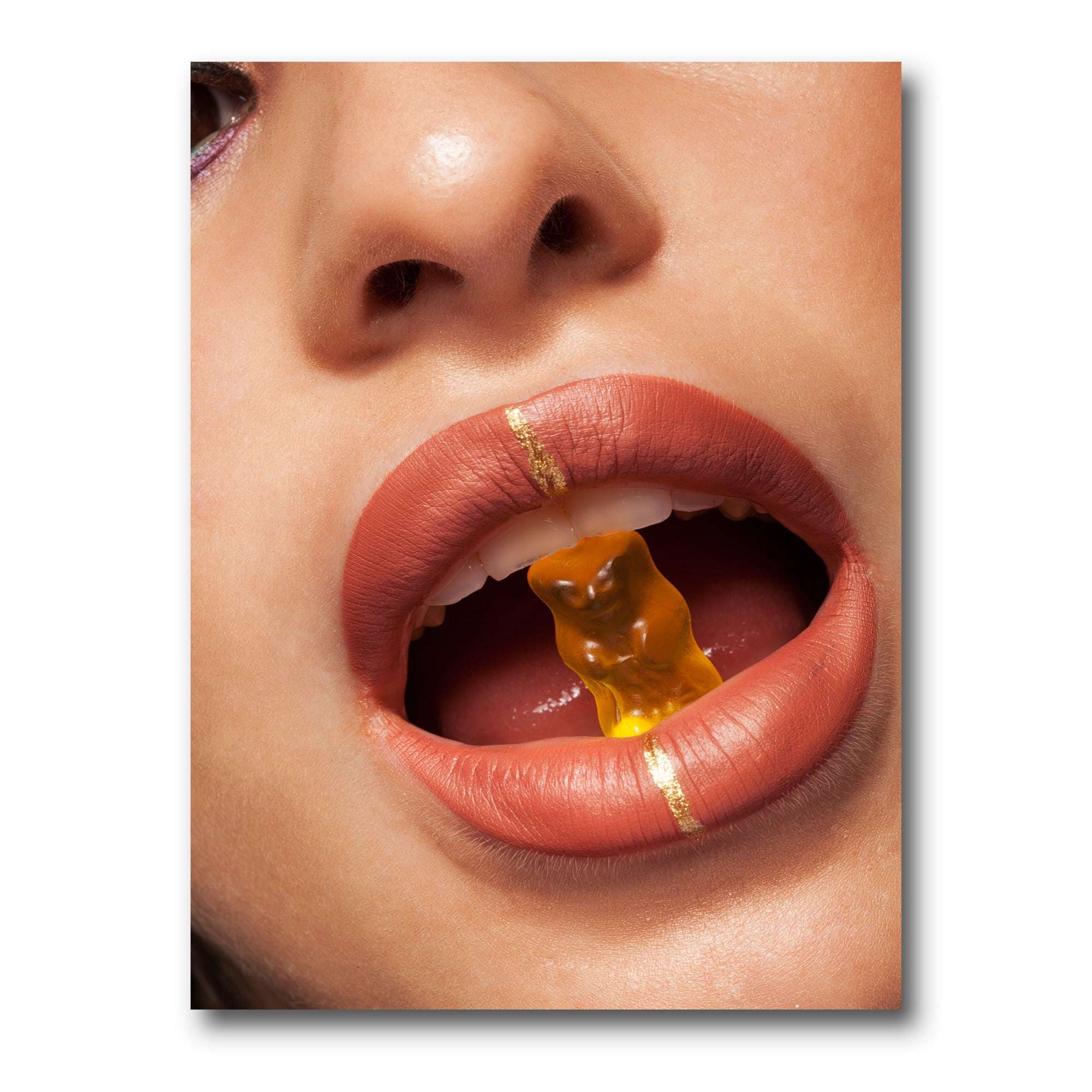 Designart ' Close Up VIew of Female Lips Biting Gummy Bear ' Modern Canvas Wall Art Print